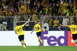 Borussia Dortmund&#039;s Niclas Fullkrug celebrates scoring their first goal with Marcel Sabitzer and Julian Brandt [Leon Kuegeler/Reuters]