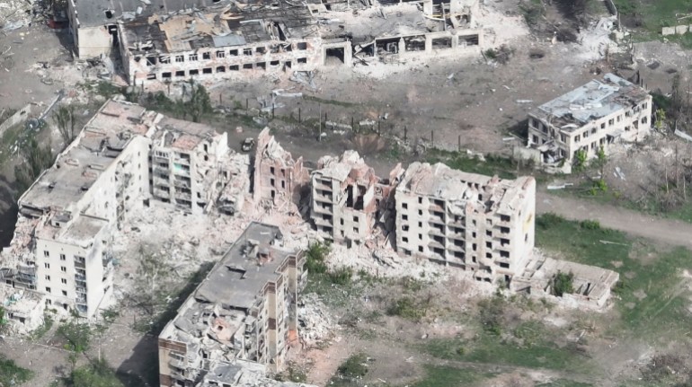 A drone image from Chasiv Yar.  It shows destroyed houses and bomb craters.