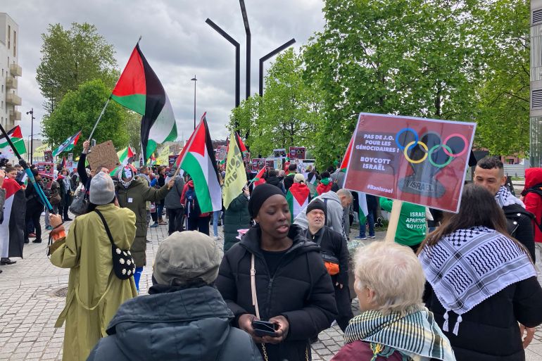Demonstrators demanding the boycott of Israel during Olympic Games demonstrate outside the Paris Olympic organizing committee headquarters, Tuesday, April 30, 2024 in Saint-Denis, outside Paris. About 300 pro-Palestinian demonstrators took part on the protest. (AP Photo/Alexander Turnbull)