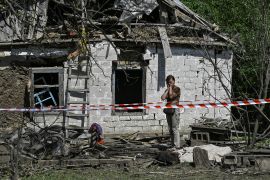 A local resident reacts next to a residential building damaged by a Russian missile strike in the village of Novohupalivka, amid Russia's attack on Ukraine, in Zaporizhzhia region, Ukraine August 26, 2024. REUTERS/Stringer