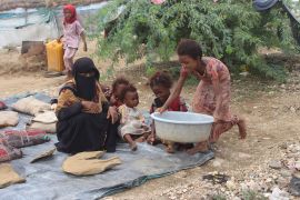 A family displaced by flooding sits near their shelter in the city of Abs in southwest Yemen after heavy seasonal rains in country have resulted in rising floodwaters on Thursday, Aug. 8, 2024 [AP Photo/ Eissa Ahmed]