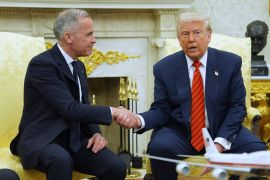 Donald Trump and Mark Carney shake hands in the Oval Office.