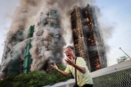 Wong, 71, displays visible distress after revealing that his wife remains trapped in Wang Fuk Court during a devastating fire in Tai Po, Hong Kong. The catastrophic blaze has killed at least 146 people, with dozens still unaccounted for, after flames engulfed the residential towers that housed 4,600 residents [Tyrone Siu/Reuters]