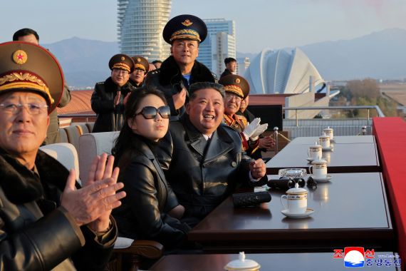 North Korean leader Kim Jong Un (3rd L) and his daughter Ju Ae (2nd L) watching a demonstration flight commemorating the 80th anniversary of the founding of the Korean People's Army Air Force at Kalma Airfield in Wonsan, Gangwon Province.