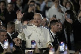 Pope Leo XIV waves as he arrives for a visit to Bkerki, the seat of the Maronite Church in Lebanon, on Monday [Bilal Hussein/AP]