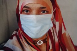 A woman wears a face mask [Rachid Mohsen/Al Jazeera]