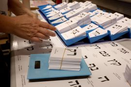 A worker weighs newly printed ballot papers, at a printing factory, ahead of the Israeli legislative elections in Kiryat Gat, southern Israel, on October 8, 2026.