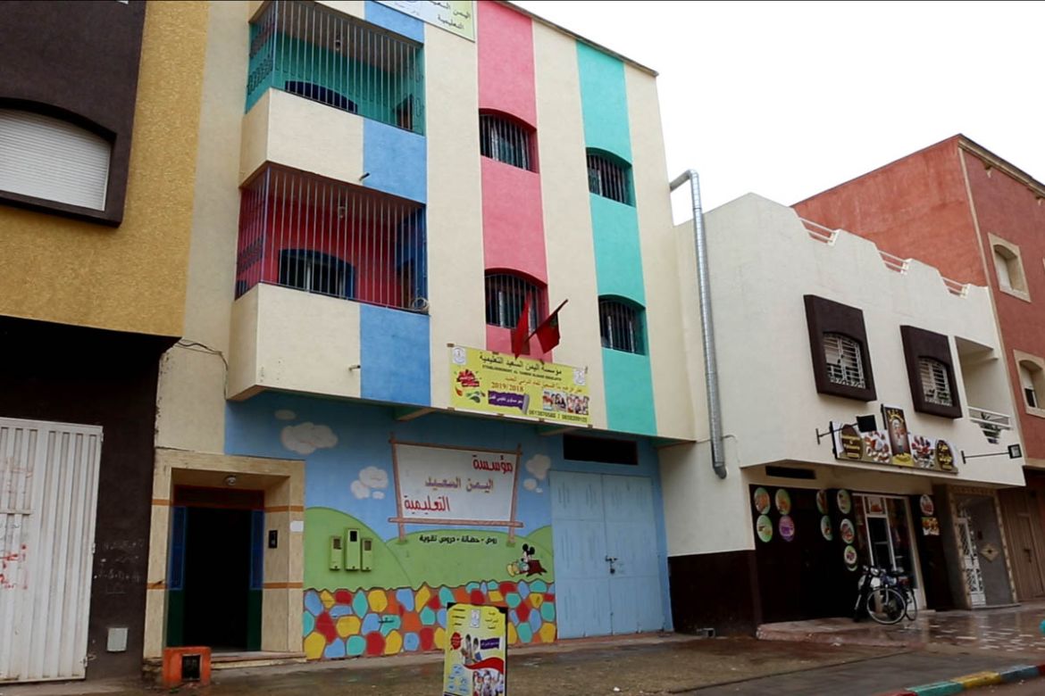 Hope kindergarten is located in a residential block in Kenitra, about 50km from the capital Rabat. It’s brightly painted walls makes it stand out from neighbouring buildings. [Faras Ghani/Al Jazeera]