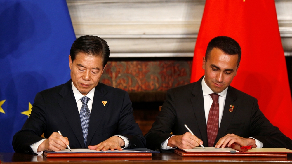 Di Maio, right, and Chinese Commerce Minister Zhong Shan sign some of the 29 accords [Yara Nardi/Reuters]