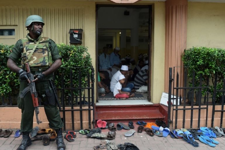 A Sri Lankan army soldier guards a mosque in Sri Lanka’s capital Colombo on March 9, 2018, amid fears that anti-Muslim riots in the central region of Kandy could spre