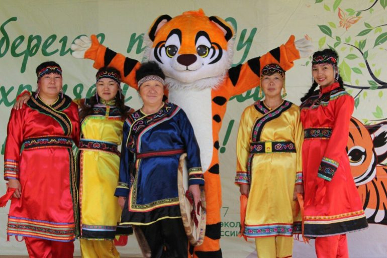 Five women from the Udege Indigenous group in Russia pose for a photo