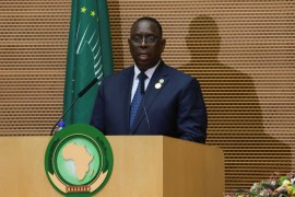 Senegal's President Macky Sall standing at a podium