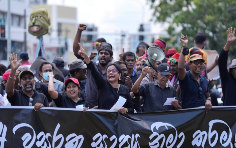 Sri Lankans protest demanding president Gotabaya Rajapaksa resign, in Colombo, Sri Lanka, Tuesday, April 5, 2022. 