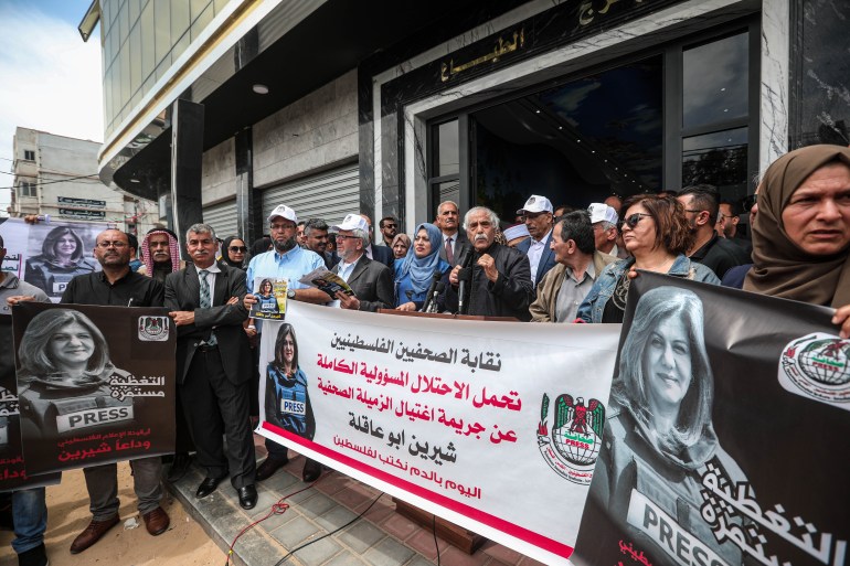 Palestinians gather in front of Al Jazeera bureau in Gaza to protest Israeli killing of Al Jazeera Correspondent