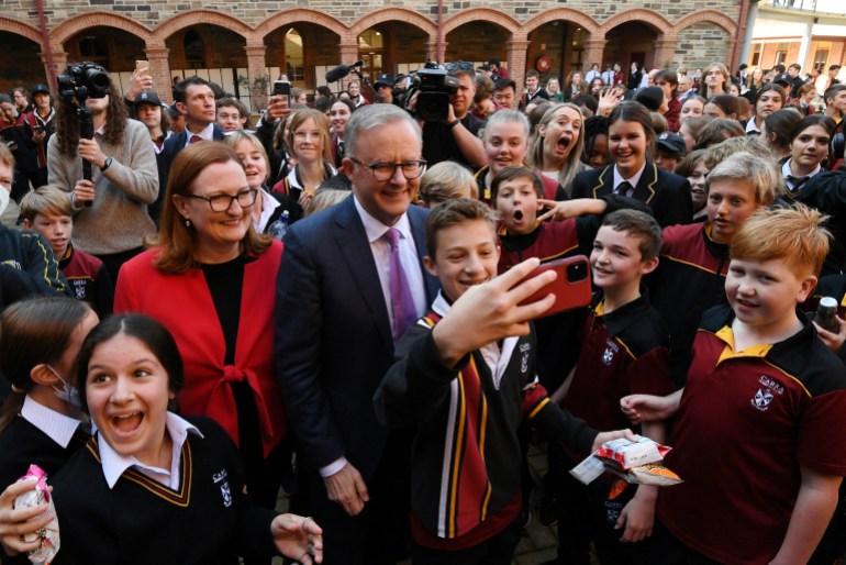 Anthony Albanese meets a crowd of supporters during a visit to a college in Adelaide