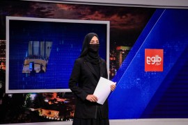 Khatira Ahmadi, an Afghan presenter at Tolo TV reads news