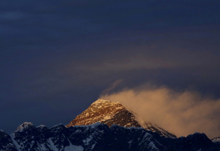 FILE PHOTO: Light illuminates Mount Everest, during sunset in Solukhumbu District also known as the Everest region, November 30, 2015.