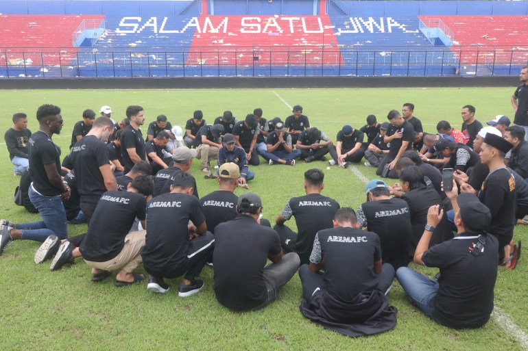 Arema FC players and officials visit Kanjuruhan Stadium, after a riot and stampede following a soccer match between Arema vs Persebaya in Malang, East Java province, Indonesia, October 3, 2022.