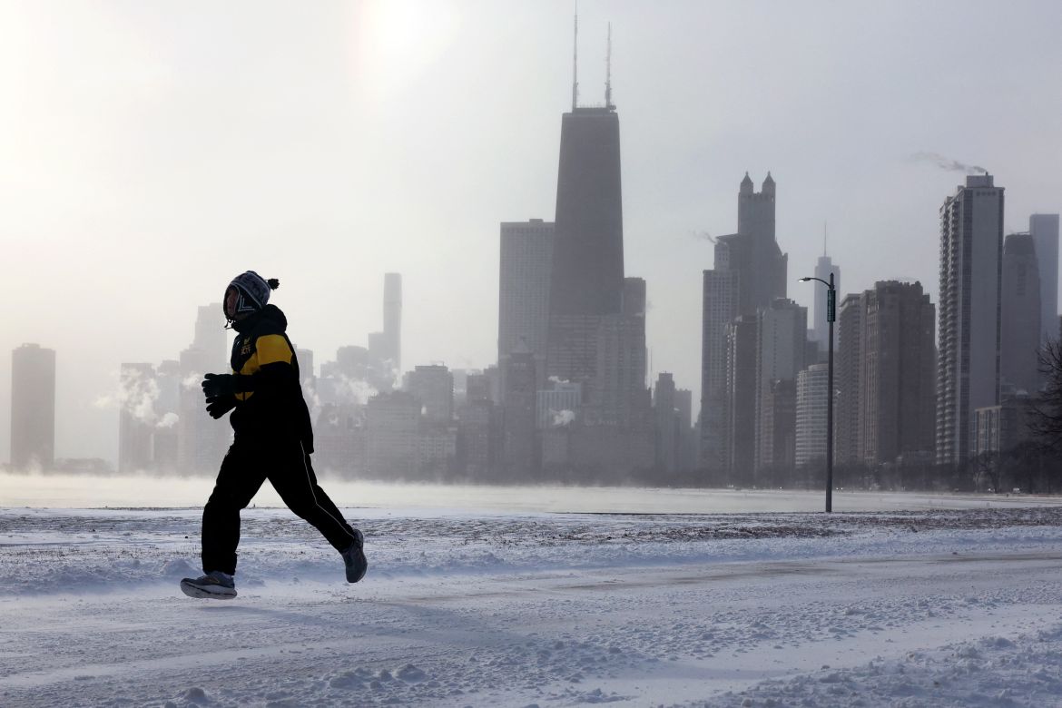 A person jogs alongside frozen Lake Michigan in Chicago