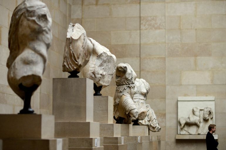 A man looks at the Parthenon Marbles