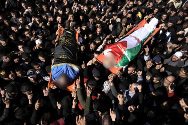 People attend a funeral of Palestinians killed by Israel