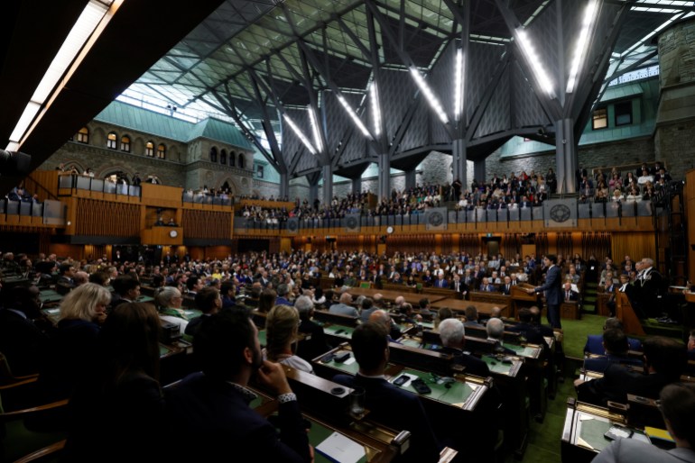 Canadian Prime Minister Justin Trudeau speaks ahead of the speech of Ukraine's President Volodymyr Zelenskiy at the House of Commons on Parliament Hill in Ottawa, Ontario, Canada September 22, 2023. The photo shows a wide view of the House, with its seats filled.