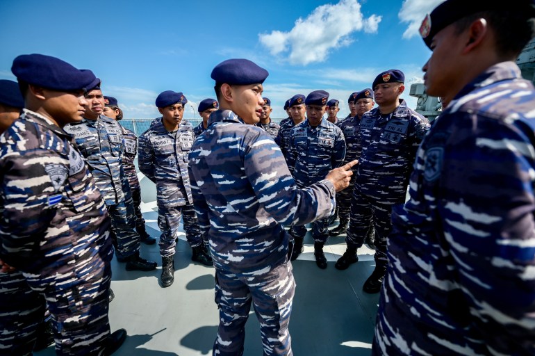 Indonesian sailors during the drills. They're standing in a group