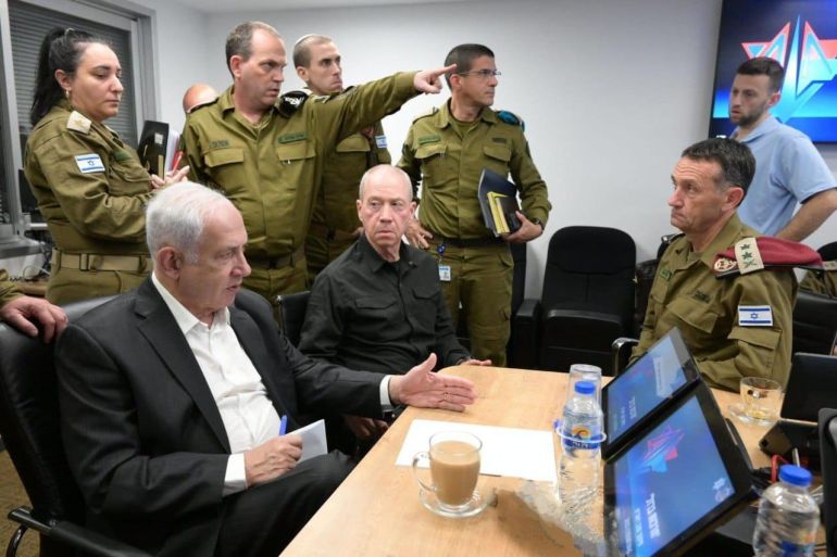 A handout photo made available by the Israeli Government Press Office shows Israeli Prime Minister Benjamin Netanyahu (L) during a situation assessment meeting in Tel Aviv, Israel, 08 October 2023. Rocket barrages were launched from the Gaza Strip as of early 07 October in a surprise attack claimed by the Islamist movement Hamas. The Israeli Sec