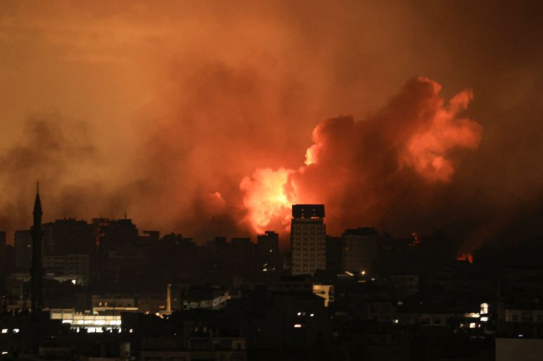 A ball of fire erupts in Gaza City after an Israeli air strike
