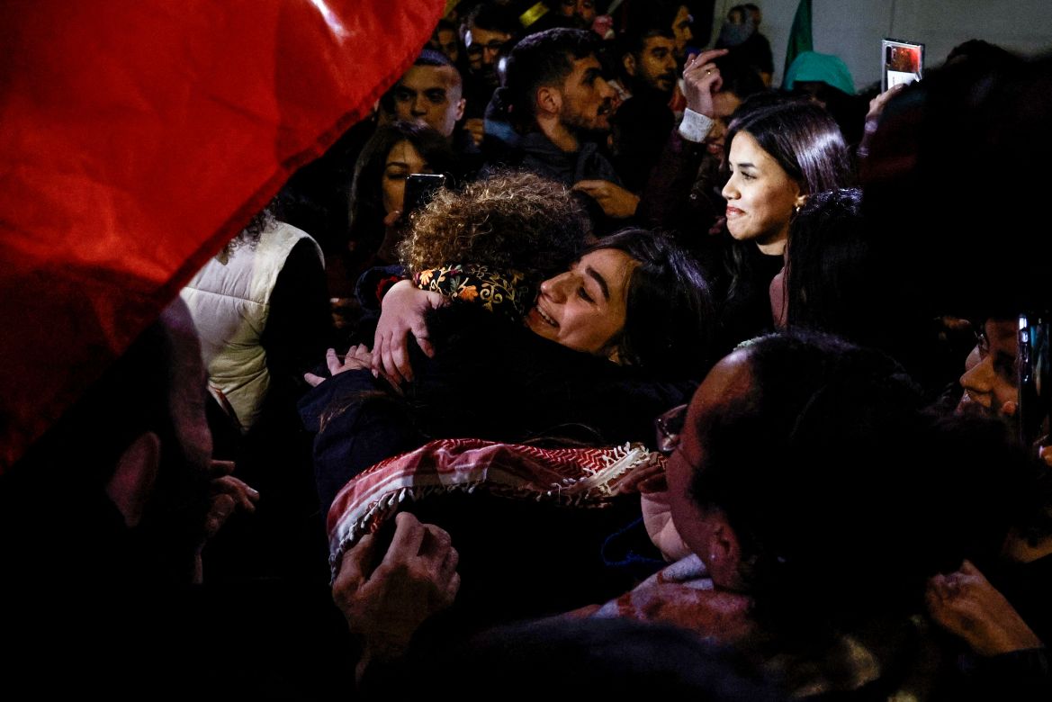 Newly released Palestinian prisoner Rouba Assi hugs relatives during a welcome ceremony for prisoners freed from Israeli jails in exchange for Israeli hostages released by Hamas from the Gaza Strip, during a welcome ceremony in Ramallah in the occupied West Bank.