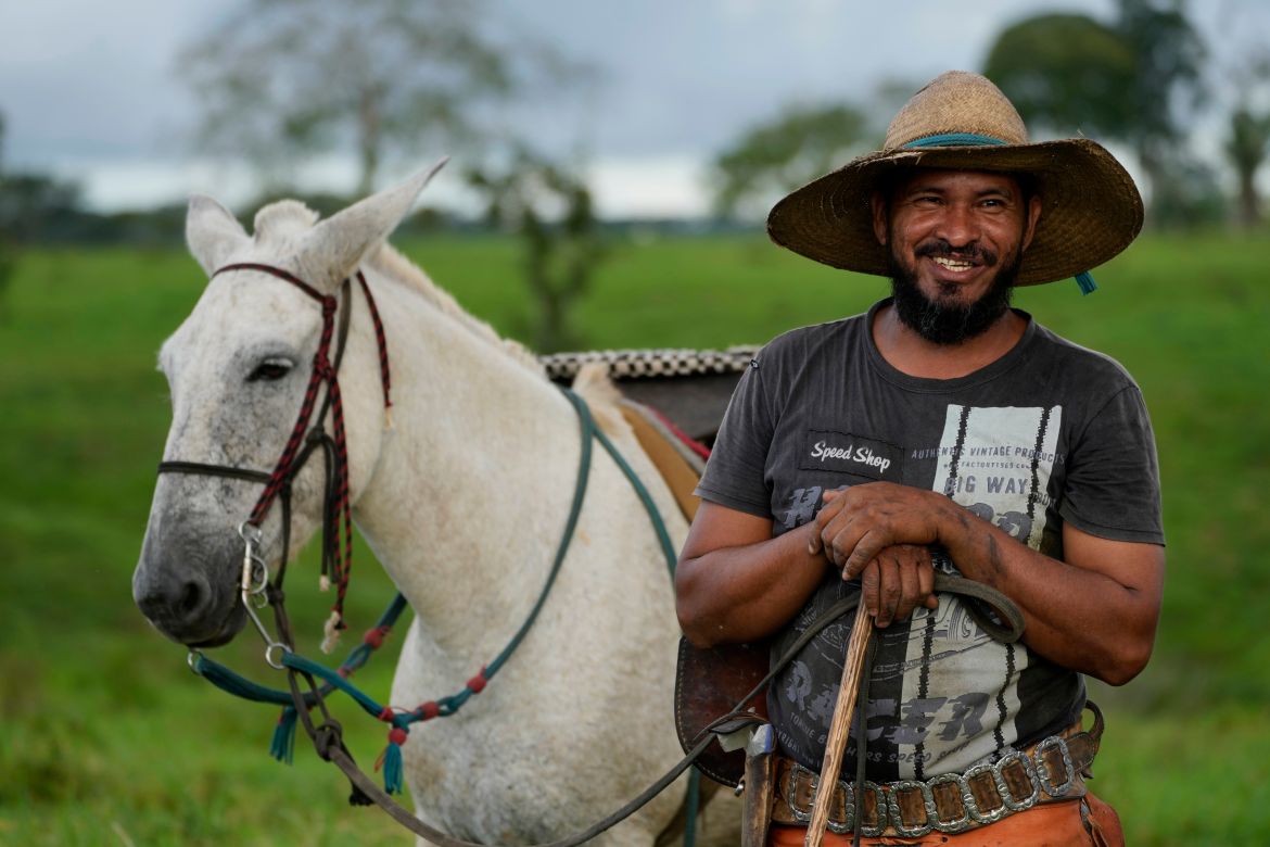 Cowboy Alexandre Rodrigues speaks after finishing work weighing and marking calves, in a corral at the Fazenda Itaituba, a farm in the municipality of Bujari, near the city of Rio Branco, Acre state, Brazil.