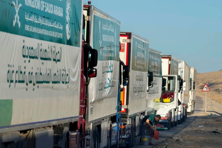 Trucks carrying humanitarian aid from King Salman humanitarian aid and relief center (KSrelief), line up as they prepare to cross Rafah crossing port to Gaza Strip, Wednesday