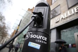 An electric car is plugged into a charging point in London, UK, in this April 7, 2016 photo [Neil Hall/Reuters]