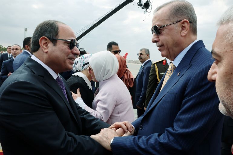 Turkey’s President Tayyip Erdogan is welcomed by Egypt's President Abdel Fattah al-Sisi at the airport in Cairo, Egypt