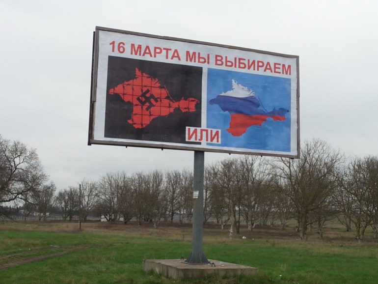 A billboard urging Crimeans to vote for return to Russia. The sign reads, On March 16, we choose-1708436105
