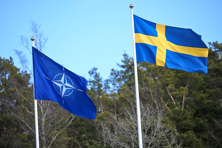 The NATO flag is raised at a ceremony at the Musko navy base near Stockholm, Sweden